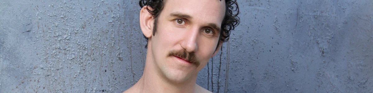 Adult model Greg McKeon in a neutral head and shoulders portrait